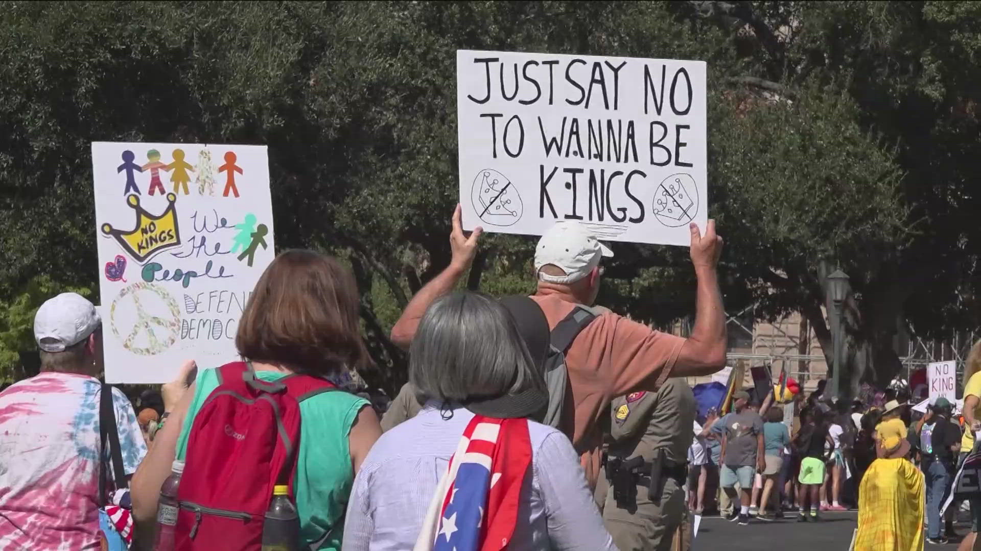 No Kings rally with protesters holding signs